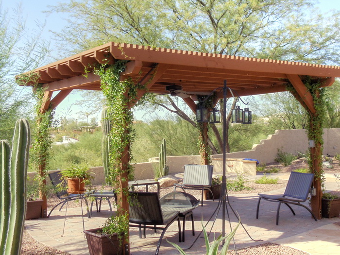 Wood pergola shade structure over an outdoor living and seating area